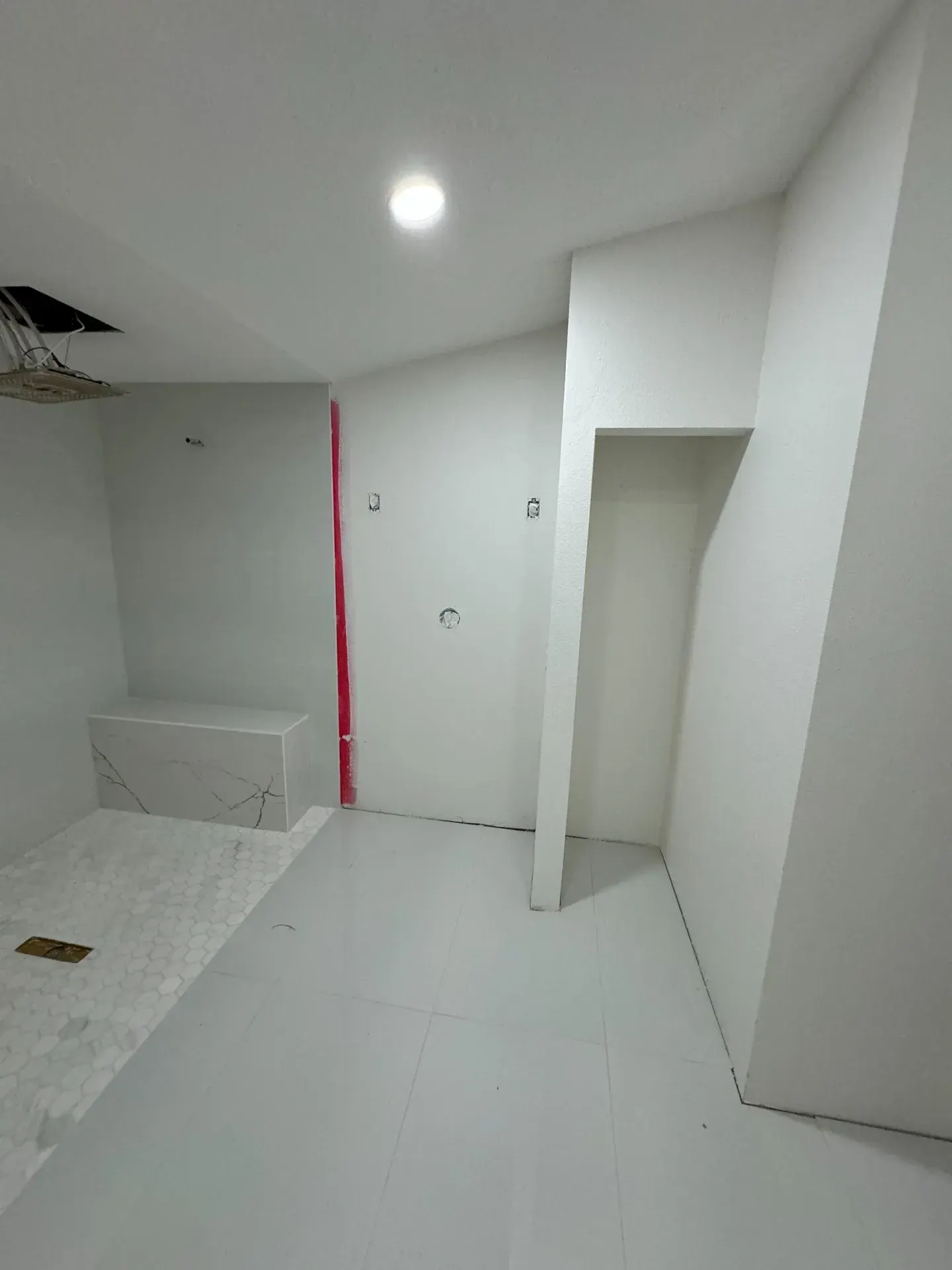 White bathroom floor and shower area